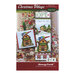 Front cover of the Christmas Village - Pet Shop cross stitch pattern with the finished full design and the ornament version isolated on a Christmas tree back drop.