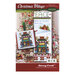 Front cover of the Christmas Village - Pet Store cross stitch pattern with the finished full design and the ornament version isolated on a Christmas tree back drop.