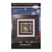 Front of the Pattern of the Month Series Peace cross stitch pattern with the finished design in a black wooden frame isolated on a wintry scene.