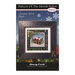 Front of the Pattern of the Month Series Noel cross stitch pattern with the finished design in a black wooden frame isolated on a wintry scene.