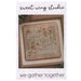 The front of the We Gather Together cross stitch pattern, showing the completed project with coordinating décor.