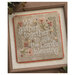 The completed We Gather Together cross stitch project finished with orange trim and framed.