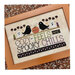 The completed WordyBirds - October cross stitch project framed and staged on a fall printed backdrop.