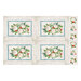 Cream-colored placemat panel with four blocks of seashells and starfish on a bed of holly leaves bordered by sandy wooden planks.