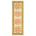 The completed Fancy Star Table Runner, colored in warm fabrics from the Sunflower Whispers collection by Riley Blake Designs, isolated on a white background. 