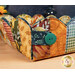 A close up on the corner of the basket, showing fabric and button details.