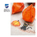 A super close up on the stitched pumpkin and black cat, staged with bright orange lantern fruit. 