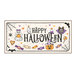 The completed Halloween cross stitch project with a ghost, bat, pumpkin, spider, candy, and more, isolated on a white background.