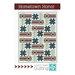 Front cover of the pattern showing the completed quilt, colored in red, gray, and blue batik fabrics.