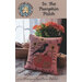 Decorative fall-themed cross-stitch pattern titled "in the pumpkin patch" with a crow perched on top of a pumpkin