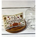 Gratitude cross stitch pattern displayed on a white wood background. 