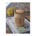 Finished sewing pinkeep cross stitch project on top of a finch printed picture.