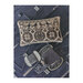 Finished cross stitch decorative pillow laid on a midnight blue backdrop.