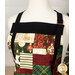 A close up on the neckline of the apron, demonstrating patchwork details and lining fabrics.