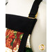 A close up on the adjustable neck strap of the apron.