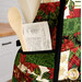 A shot of the mannequin, showing a wooden spoon and recipe card sticking out of the pocket.