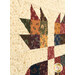 An angled, super close up on the patchwork of one of the bear claw blocks, demonstrating details on the fabric prints and colors.