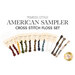 American Sampler cross-stitch floss set with multiple thread colors and needles.