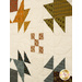 A super close up on the patchwork, demonstrating fabric print and color details as well as top quilting effects.
