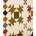 An angled close up on the patchwork, demonstrating fabric print and color details as well as top quilting effects.