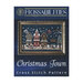 Front cover of the Christmas Town cross stitch pattern with the finished pattern in an ornate gold frame isolated on a wispy blue background.