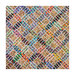 Multicolor quilt with sand castle block patterns.