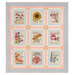 The completed Seed Packets quilt, colored in cream, green, pastel blue, and pink fabrics from the My Secret Garden collection by Moda Fabrics, isolated on a white background. 
