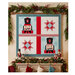 Festive wall hanging with two nutcracker figures and red star blocks, framed by holiday garland.
