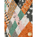 A close up on the patchwork of the quilt, demonstrating fabric prints and color details as well as top quilting effects.
