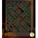 A shot of the quilt in a dimly lit room, demonstrating which parts of the quilt glow in the dark.