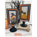 The two completed cross stitch projects of Boo and Hazel, set on faded gray fabric and stitched with bright colors, displayed on a Paisleys and Polka Dots mount.