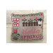 Finished Hello Spring cross stitch pattern on a pillow.