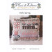 Cross stitch pillow pattern cover reading “Hello Spring” with a spring-themed stitched cushion.