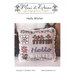 Cross stitch pillow pattern cover reading “Hello Winter” with a wintry-themed stitched cushion.