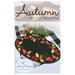 Front cover of the pattern showing the completed wool mat, embroidered with elegant autumnal colors.