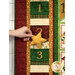 A close up on the quilt where a model demonstrates putting the puffy star into the day 3 dimensional pocket.