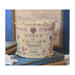 Finished Let Us In Love cross stitch drum pinkeep on wooden boards next to white wooden stars.