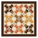 Oak Grove Quilt kit with stitched maple leaves and acorns isolated on a white background.