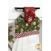 A shot of the top section of the towel taken from a slight angle, showing details on the fabric as well as the fabric button.
