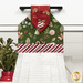 A head-on close up on the top section of the towel, showing details on the fabric as well as the fabric button.
