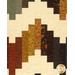 A close up on the patchwork demonstrating fabric prints, colors, and top quilting details.