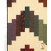 A close up on the patchwork demonstrating fabric prints, colors, and top quilting details.