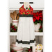 The completed Hanging Towel colored in red, cream, and black fabrics from the Poinsettia Radiance collection from White Owl Textiles, staged on a kitchen drawer with coordinating decor.