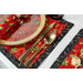 A super close up of the placemat, staged with coordinating cutlery, showing details on the print.