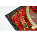 A super close up of the placemat, staged with coordinating cutlery, showing details on the print.