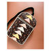 A black completed Weekend Sling Bag isolated on a copper background.