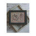 Finished Liberty Rose cross stitch patterns stitched together in a wooden frame.