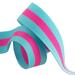 A aqua and pink ribbon, curled and resting on a flat surface.