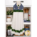 The completed Hanging Towel colored in green, navy, and cream fabrics from the Tee Time collection from Clothworks, staged on a kitchen drawer with coordinating decor.