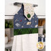A shot of the top section of the towel taken from a slight angle, showing details on the bell fabric as well as the fabric button.